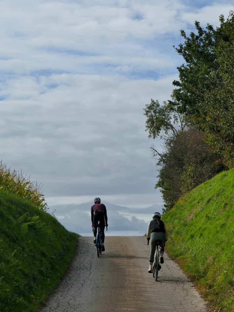 A pair of road cyclists enjoying a guided tour in the Krakow countryside.