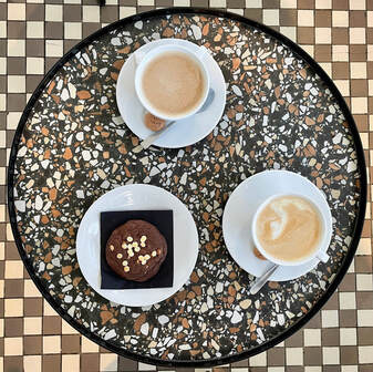 Road bike leaning against the modern Mech cafe nestled in the forest of Las Wolski, Kraków.