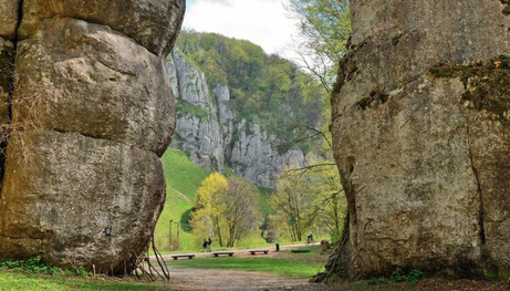Dramatic white limestone rock formations and boulders along the road cycling route in Ojców.